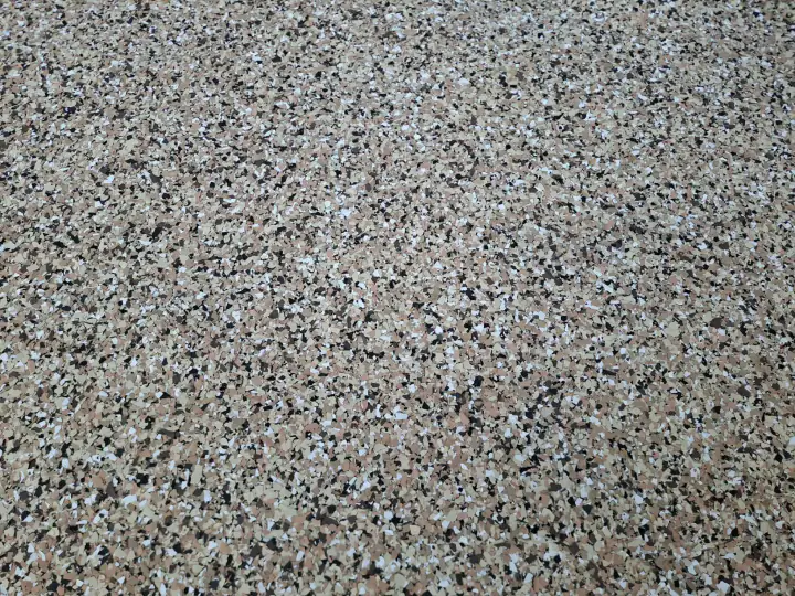 Tan decorative flake flooring detail
